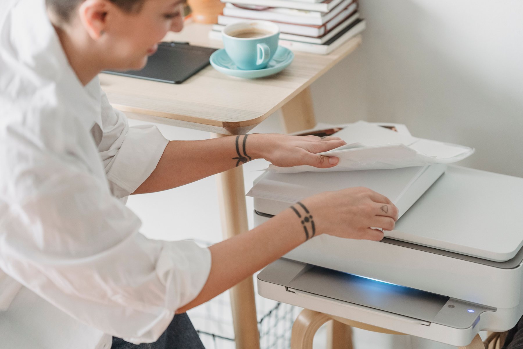 Professional using a modern office printer