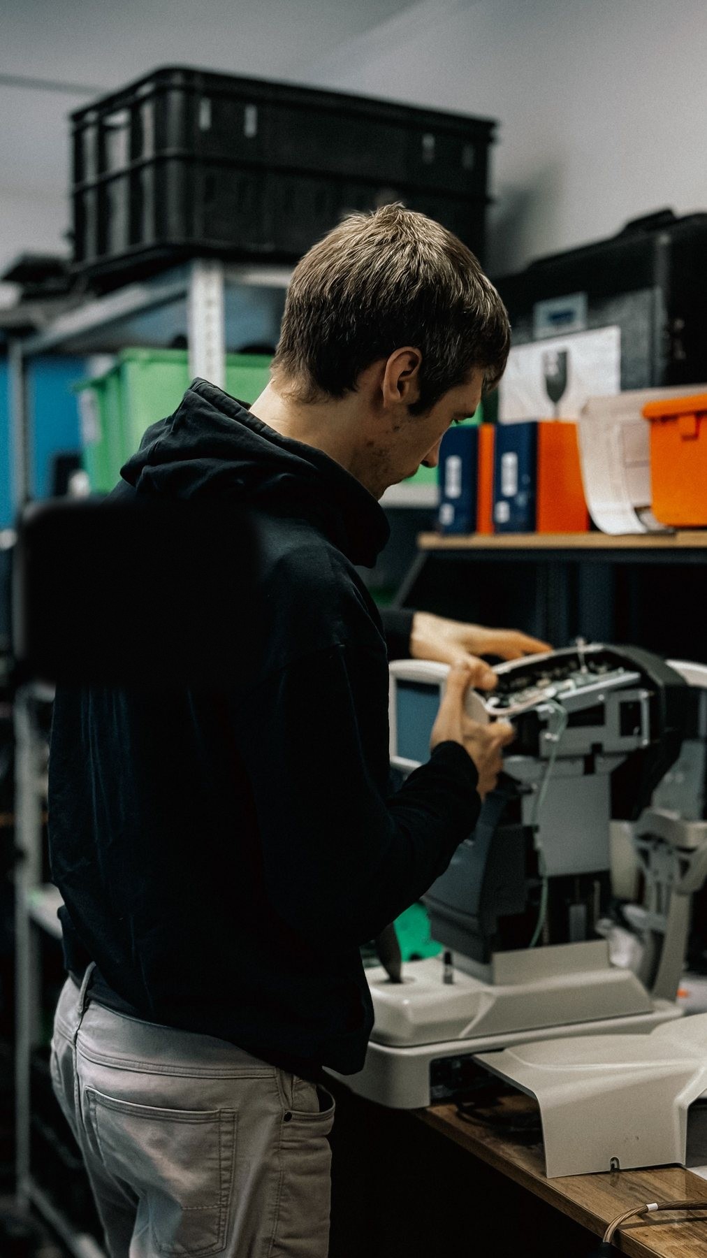 Technician repairing printer equipment